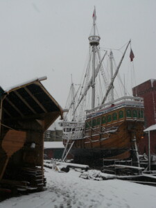 A winter boatyard with a large shipped moored on it