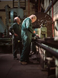 Two volunteers working in one of the workshops at Underfall Yard